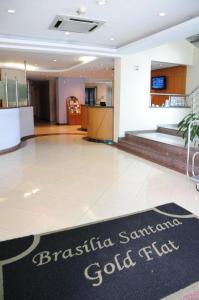 a hotel lobby with a sign on the floor at Residence Flat 143 em Santana in Sao Paulo
