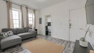 a living room with a couch and a table at Atlantic Suite by the Boardwalk 3B in Atlantic City