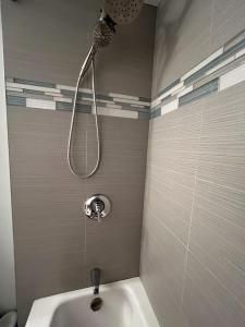 a shower in a bathroom with a sink at Location+Comfort+Convenience in Boston