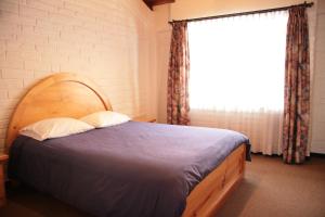 Postel nebo postele na pokoji v ubytování Apartamentos Los Quipus