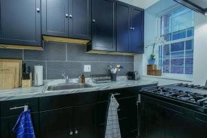 A kitchen or kitchenette at Atlantic Suite by the Boardwalk 1A
