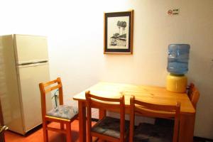 Kuchyň nebo kuchyňský kout v ubytování Apartamentos Los Quipus