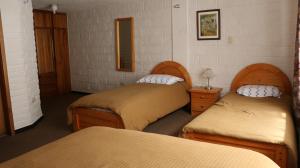 Postel nebo postele na pokoji v ubytování Apartamentos Los Quipus