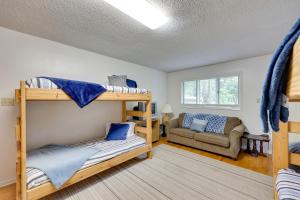 a living room with bunk beds and a couch at Lakefront Hot Springs Home with Furnished Deck! in Hot Springs