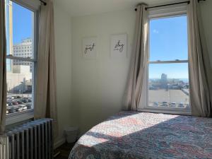 a bedroom with a bed and a large window at The Oakden Suites - Orange Loop D6 in Atlantic City
