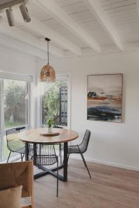 a dining room with a table and chairs at Reardon Retreat in Port Fairy