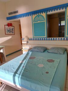 Letto o letti in una camera di STUDIO FONCTIONNEL dans HOTEL CARAYOU SPA PISCINES