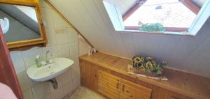a small bathroom with a sink and a window at Holiday home in Balatonkeresztur 44886 in Balatonkeresztúr +29 photos