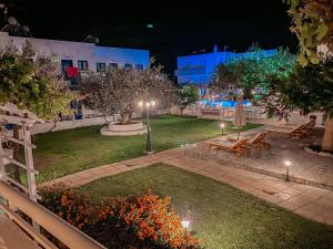 a garden at night with lights and a park at Lindos Athena in Lindos