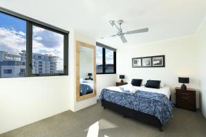 Postel nebo postele na pokoji v ubytování Beachfront Towers + 37 fotografií