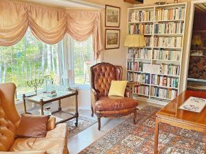 a living room with a couch and a chair and a table at Holiday home NYNÄSHAMN in Nynäshamn