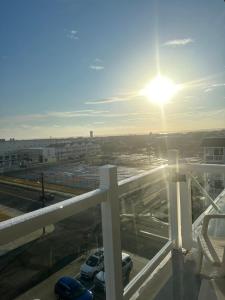 a view of a parking lot with the sun shining at Waikiki Oceanfront Inn in Wildwood Crest