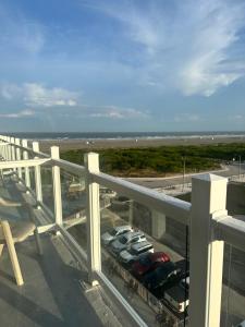 a balcony of a building with a view of the ocean at Waikiki Oceanfront Inn in Wildwood Crest