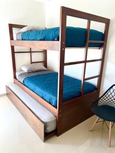 Una cama o camas en una habitación de Moderno depa cerca del malecón by G P S rentas