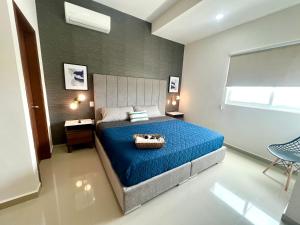 Una cama o camas en una habitación de Moderno depa cerca del malecón by G P S rentas
