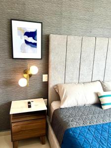 Una cama o camas en una habitación de Moderno depa cerca del malecón by G P S rentas
