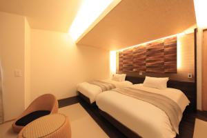 Posteľ alebo postele v izbe v ubytovaní Hotel Miyuki
