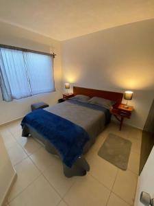 Llit o llits en una habitació de Casa Pirules- Parque Metropolitano