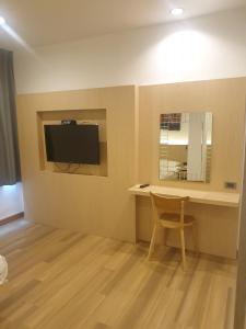 TV a/nebo společenská místnost v ubytování Sakura Sky Residence