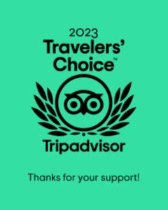 a logo for the travelers choice triad visitor at Coral Tree Inn in Cairns