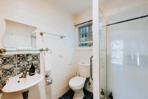 a bathroom with a toilet and a sink and a shower at Apple Tree Cottage - An Idyllic Country Reset in Mudgee