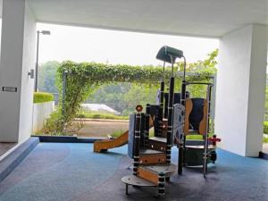 a gym with an exercise bike in front of a window at Medic Homestay Selayang Residence 280 in Batu Caves