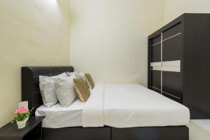 Postel nebo postele na pokoji v ubytování Zai Ham Homestay