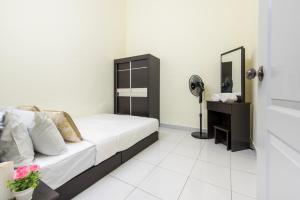 Postel nebo postele na pokoji v ubytování Zai Ham Homestay
