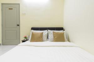 Postel nebo postele na pokoji v ubytování Zai Ham Homestay