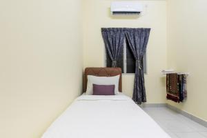 Postel nebo postele na pokoji v ubytování Zai Ham Homestay