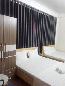 Postel nebo postele na pokoji v ubytování PHÚC AN HOSTEL
