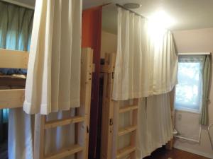 Postel nebo postele na pokoji v ubytování Bellscabin Guesthouse