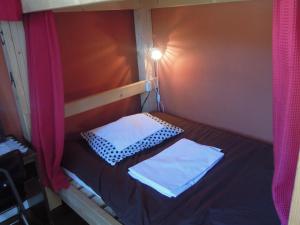 Postel nebo postele na pokoji v ubytování Bellscabin Guesthouse