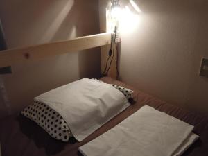 Postel nebo postele na pokoji v ubytování Bellscabin Guesthouse