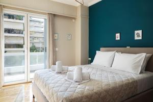 Кровать или кровати в номере Comfort & Relax apartment in Athens Riviera