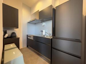 Een keuken of kitchenette bij SETO CLAS AJI THE SEASIDE HILLS RESORT