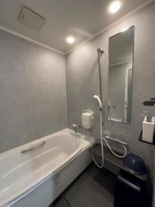 Een badkamer bij SETO CLAS AJI THE SEASIDE HILLS RESORT