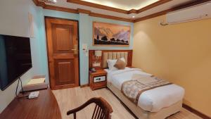 TV o dispositivi per l'intrattenimento presso Sherpa Home Hotel