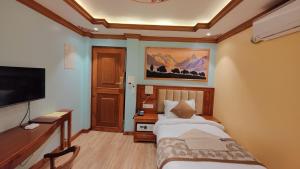 TV o dispositivi per l'intrattenimento presso Sherpa Home Hotel