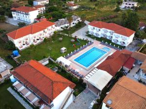 an aerial view of a house with a swimming pool at Akis Studios Alykes in Alykes
