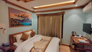Letto o letti in una camera di Sherpa Home Hotel