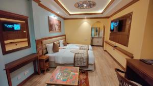 Letto o letti in una camera di Sherpa Home Hotel