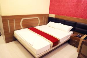 Postel nebo postele na pokoji v ubytování HOTEL PERFECT PLAZA