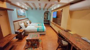 Letto o letti in una camera di Sherpa Home Hotel
