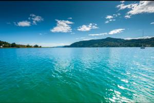 a view of a large body of water at Strandhotel Habich in Krumpendorf am Wörthersee