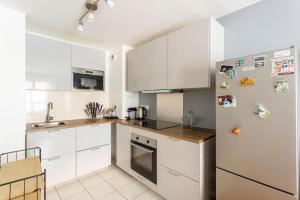 Kuchnia lub aneks kuchenny w obiekcie Cosy appart entre Paris et Disneyland
