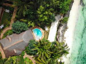 een luchtzicht op een resort met een zwembad en een strand bij Tulia Zanzibar Unique Beach Resort in Pongwe