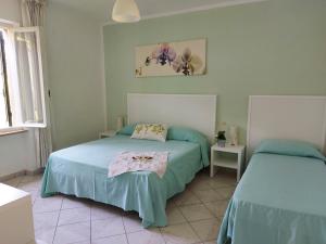 Postel nebo postele na pokoji v ubytování Hotel Holiday Bambù