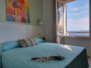 Postel nebo postele na pokoji v ubytování Hotel Holiday Bambù