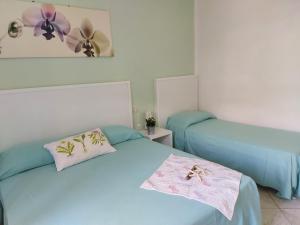 Postel nebo postele na pokoji v ubytování Hotel Holiday Bambù
